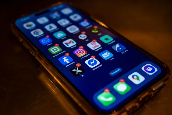 A phone with a bunch of notifications for social media apps.